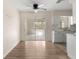 Cozy dining area featuring a ceiling fan and sliding glass doors to the Florida Room at 20639 Sw Rainbow Lakes Blvd, Dunnellon, FL 34431