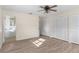 Spacious main bedroom with wood floors, ceiling fan and ensuite bathroom with closet space at 20639 Sw Rainbow Lakes Blvd, Dunnellon, FL 34431