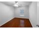 A spare bedroom with hardwood floors, a window, and light gray walls at 2722 Dodds Ln, Kissimmee, FL 34743