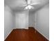 Bright bedroom features a ceiling fan, neutral walls, wood floors, and closet at 2722 Dodds Ln, Kissimmee, FL 34743