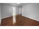 A spare bedroom featuring hardwood floors, base molding, and light gray walls at 2722 Dodds Ln, Kissimmee, FL 34743