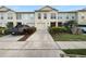 Charming townhouse featuring a private driveway, attached garage, and well-maintained landscaping at 2722 Dodds Ln, Kissimmee, FL 34743