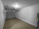 Garage with white brick and ceiling door at 2722 Dodds Ln, Kissimmee, FL 34743