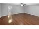 Spacious living room features gleaming wood floors and neutral paint, with a ceiling fan at 2722 Dodds Ln, Kissimmee, FL 34743