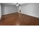 Spacious living room with hardwood floors, ceiling fan, and an open layout at 2722 Dodds Ln, Kissimmee, FL 34743