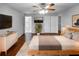 This main bedroom boasts hardwood floors, a ceiling fan, closet, and large windows that provide great natural light at 2722 Dodds Ln, Kissimmee, FL 34743