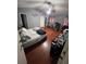 Spacious bedroom featuring a vaulted ceiling, ample lighting, and exercise equipment at 2831 S M U Blvd, Orlando, FL 32817
