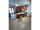 Modern kitchen featuring a granite countertop and stainless-steel appliances at 2831 S M U Blvd, Orlando, FL 32817