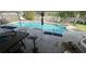 Relaxing backyard area featuring a sparkling pool, lounge chairs and patio seating at 2831 S M U Blvd, Orlando, FL 32817