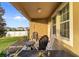 Back patio with a lounge area, seating, and view to the yard at 3320 Grande Heron Dr, Harmony, FL 34773