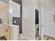 Modern bathroom with glass shower stall, storage cabinet, and a view of the toilet room at 3320 Grande Heron Dr, Harmony, FL 34773