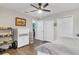 Bright bedroom with wood floors, ceiling fan, and ample closet space at 3320 Grande Heron Dr, Harmony, FL 34773
