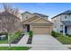 Charming two-story home with a stone facade, manicured landscaping, and a spacious two-car garage at 3320 Grande Heron Dr, Harmony, FL 34773