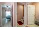 Picture from hallway showing bathroom, water closet, and bedroom at 3797 Briarwood Estates Cir, St Cloud, FL 34772