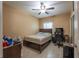 Bedroom featuring ceiling fan, tiled floor, and desk with computer at 3797 Briarwood Estates Cir, St Cloud, FL 34772