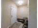 Inviting entryway with tiled floor, coat rack, and a bench at 3797 Briarwood Estates Cir, St Cloud, FL 34772