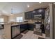 Kitchen with granite countertops, breakfast bar, and stainless appliances at 3797 Briarwood Estates Cir, St Cloud, FL 34772