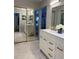Spacious bathroom featuring dual vanities, large mirrors, and modern fixtures at 4938 Samoa Cir # 6, Orlando, FL 32808