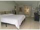 A large bedroom with great natural light, hardwood floors and minimal decorations at 4938 Samoa Cir # 6, Orlando, FL 32808
