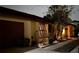 Charming single-story home featuring a landscaped front yard with a cozy walkway and a dark two-car garage at 4938 Samoa Cir # 6, Orlando, FL 32808