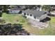 Aerial view of backyard with grass, mature trees, and shed at 509 Nicole Blvd, Ocoee, FL 34761