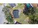 Overhead view of fenced backyard with grass and mature trees at 509 Nicole Blvd, Ocoee, FL 34761