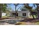 Well-maintained single-story home with lush trees, a spacious driveway and charming curb appeal at 509 Nicole Blvd, Ocoee, FL 34761