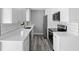 Bright kitchen with stainless steel appliances, white subway tile backsplash, and light wood flooring at 509 Nicole Blvd, Ocoee, FL 34761