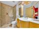 Well lit bathroom featuring a tiled shower with glass door and sleek vanity at 535 N Interlachen Ave # 107, Winter Park, FL 32789
