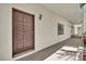 Condominium front door with dark brown color and unit number 107 at 535 N Interlachen Ave # 107, Winter Park, FL 32789