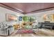 Bright living room showcasing contemporary decor, a rug, and indoor plants at 535 N Interlachen Ave # 107, Winter Park, FL 32789