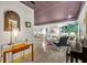 Well-lit living room featuring marble floors and eclectic furnishings at 535 N Interlachen Ave # 107, Winter Park, FL 32789