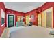 Spacious bedroom featuring hardwood floors, ample closet space, and comfortable sitting area at 535 N Interlachen Ave # 107, Winter Park, FL 32789
