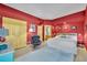 Spacious bedroom featuring hardwood floors, ample closet space, and comfortable sitting area at 535 N Interlachen Ave # 107, Winter Park, FL 32789