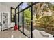Sunroom with floor-to-ceiling windows offers an abundance of natural light and serene outdoor views at 535 N Interlachen Ave # 107, Winter Park, FL 32789