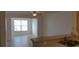 Bright living room boasts tile flooring, natural light, and an open layout at 5479 Vineland Rd # 9104, Orlando, FL 32811