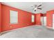 Bedroom featuring carpet, ceiling fan, and large windows with natural light at 625 Silverthorn Pl, Groveland, FL 34736