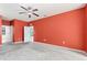 Spacious bedroom with carpet, ceiling fan, and access to ensuite bath at 625 Silverthorn Pl, Groveland, FL 34736