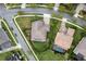 Aerial view showcasing the property's lush greenery, complemented by meticulously maintained landscaping and a brick driveway at 7135 Ticklegrass St, Winter Garden, FL 34787