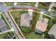Aerial view showcasing the property's manicured landscaping and desirable corner lot location with mature shade trees at 7135 Ticklegrass St, Winter Garden, FL 34787
