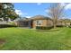 The property has a screened-in patio and a well-kept lawn, ideal for enjoying outdoor activities in the sunshine at 7135 Ticklegrass St, Winter Garden, FL 34787