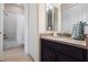 Bathroom with double door access, and a shower and bath tub combination at 7135 Ticklegrass St, Winter Garden, FL 34787