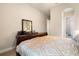 Bedroom featuring dark wood furniture, carpet flooring, and interior access to bathroom at 7135 Ticklegrass St, Winter Garden, FL 34787
