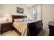 Bedroom with dark wood furniture, carpet flooring, and natural light from the window at 7135 Ticklegrass St, Winter Garden, FL 34787