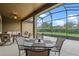 Covered patio with ceiling fan and outdoor seating overlooking the backyard at 7135 Ticklegrass St, Winter Garden, FL 34787