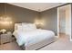 Chic bedroom with a chandelier, modern furniture, and soothing tones for a tranquil space at 7568 Marker Ave, Kissimmee, FL 34747
