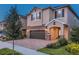 Charming two-story home with stone accents, a covered entryway, and well-manicured landscaping at 7568 Marker Ave, Kissimmee, FL 34747