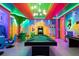 Unique game room showcasing a custom pool table, arcade games, and Super Mario-themed design at 7568 Marker Ave, Kissimmee, FL 34747