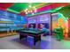 Amusing game room featuring a pool table, TVs, and playful Mario-themed accents for entertainment at 7568 Marker Ave, Kissimmee, FL 34747