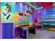 Whimsical game room featuring custom Mario-themed decor, arcade games, and colorful, playful design at 7568 Marker Ave, Kissimmee, FL 34747